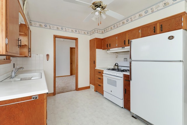 108 N Chatham St, Danvers, IL 61732 - kitchen featuring a sink, a ceiling fan, light floors, brown cabinets, and white appliances