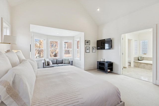 2735 N Dayton St, Chicago, IL 60614 - bedroom with high vaulted ceiling, light colored carpet, recessed lighting, baseboards, and ensuite bathroom