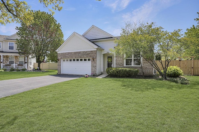 view of front of home featuring asphalt driveway, a garage, and brick siding