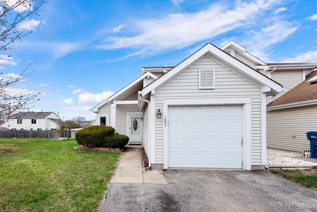 1832 Schmale Ct, Glendale Heights, IL 60139 - view of front of property with an attached garage, fence, aphalt driveway, and a front yard