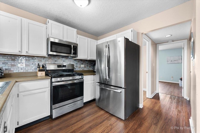 1832 Schmale Ct, Glendale Heights, IL 60139 - kitchen with tasteful backsplash, a textured ceiling, white cabinets, appliances with stainless steel finishes, and dark wood-style floors