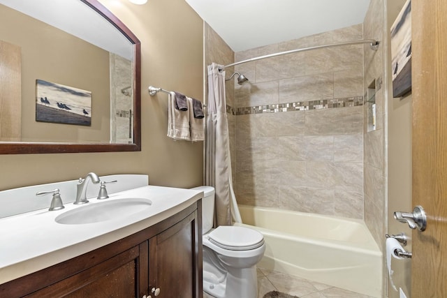bathroom with toilet, shower / tub combo, vanity, and tile patterned floors