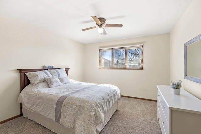 bedroom with baseboards, a ceiling fan, and light colored carpet