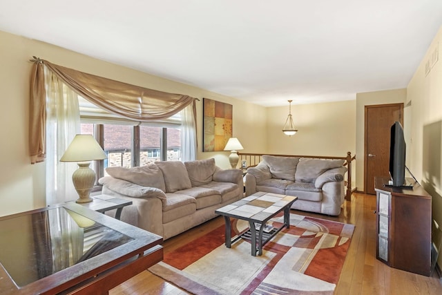 living area with hardwood / wood-style flooring
