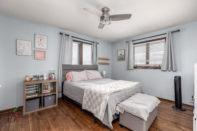 bedroom with baseboards, ceiling fan, and wood-type flooring