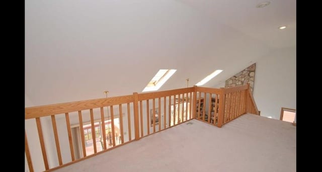 187 Hilltop Dr, Lake In The Hills, IL 60156 - hall featuring carpet flooring, a skylight, and vaulted ceiling