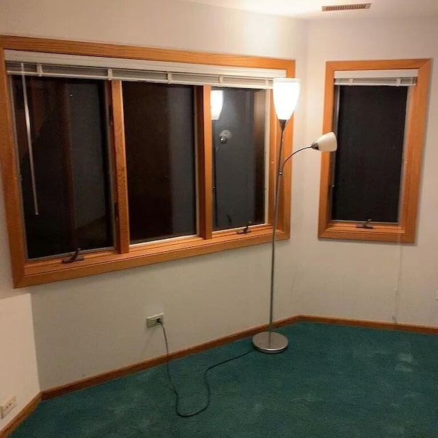 187 Hilltop Dr, Lake In The Hills, IL 60156 - carpeted spare room featuring baseboards