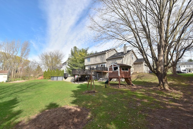 view of yard with stairs and a deck