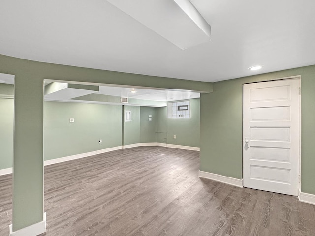 608 W 107th St, Chicago, IL 60628 - below grade area with wood finished floors, baseboards, and recessed lighting