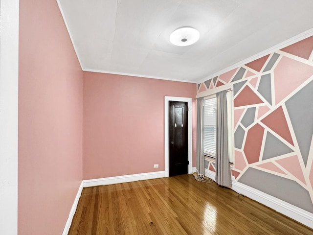 608 W 107th St, Chicago, IL 60628 - empty room with wood finished floors, baseboards, and crown molding