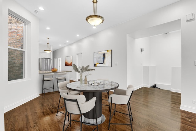 dining room featuring visible vents, baseboards, recessed lighting, and dark wood-style floors