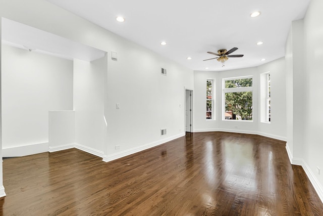 spare room featuring visible vents, a ceiling fan, recessed lighting, and dark wood finished floors
