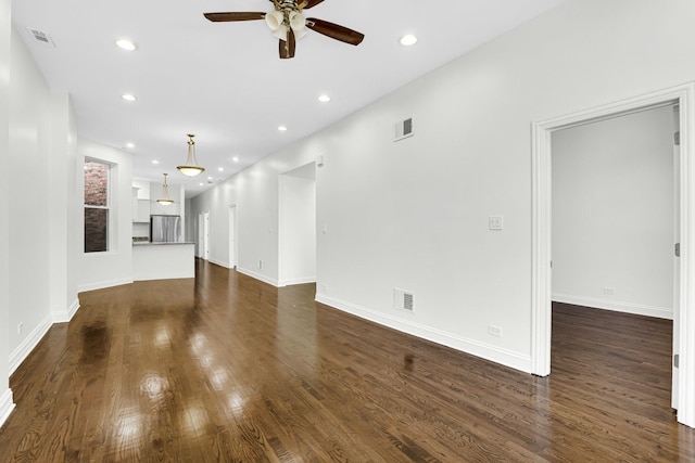 unfurnished living room featuring recessed lighting, dark wood-style flooring, visible vents, and ceiling fan