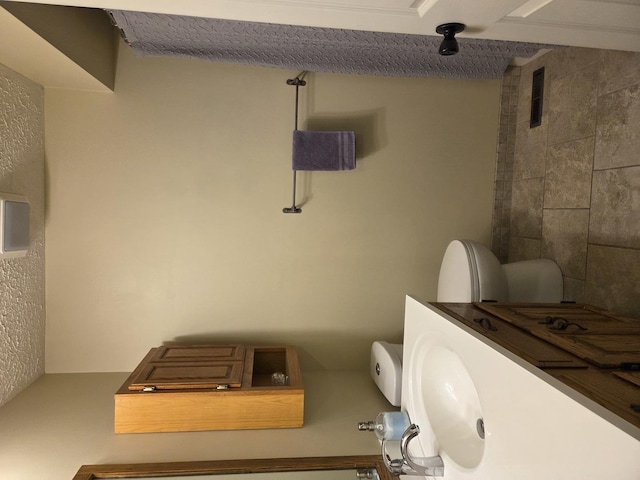 bathroom featuring visible vents and toilet