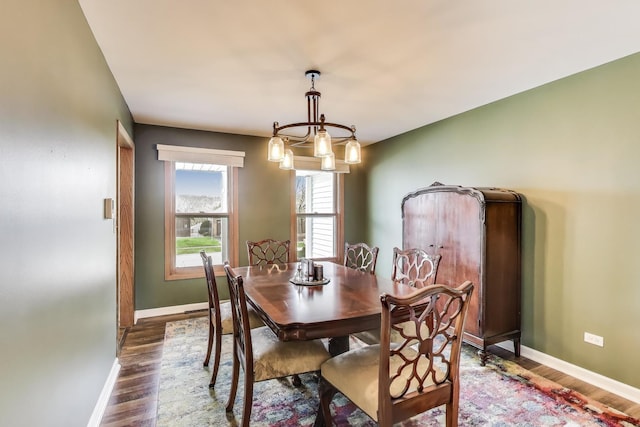 367 Quist Ct, Grayslake, IL 60030 - dining room with baseboards, a notable chandelier, and dark wood-type flooring