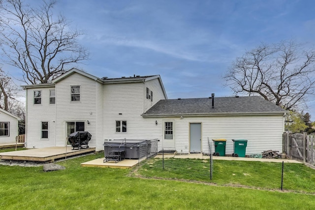 367 Quist Ct, Grayslake, IL 60030 - back of house featuring a lawn, a hot tub, fence, and a deck