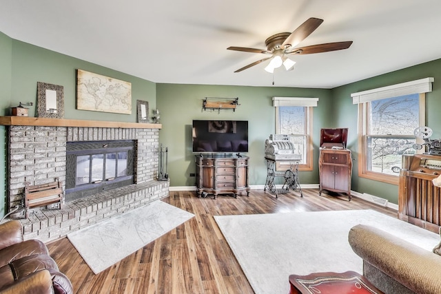 367 Quist Ct, Grayslake, IL 60030 - living room featuring baseboards, a ceiling fan, wood finished floors, and a fireplace