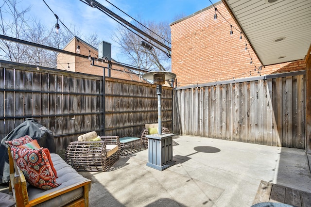 view of patio / terrace with a fenced backyard and an outdoor hangout area