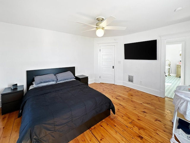 17128 Lukens Rd, Sycamore, IL 60178 - bedroom featuring light wood-style flooring, a ceiling fan, and baseboards
