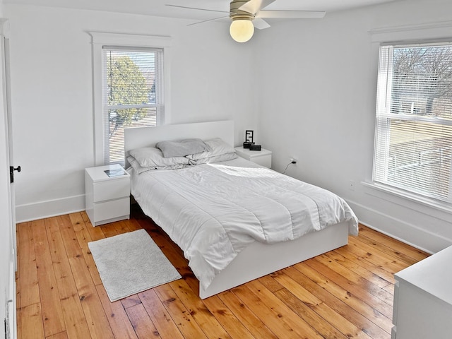 17128 Lukens Rd, Sycamore, IL 60178 - bedroom with light wood-style flooring, baseboards, and ceiling fan