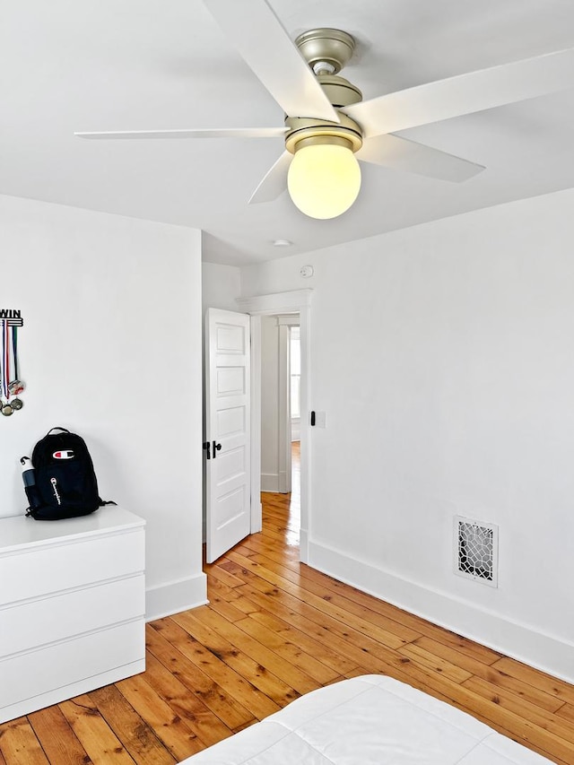 17128 Lukens Rd, Sycamore, IL 60178 - bedroom with light wood-style floors, baseboards, and ceiling fan