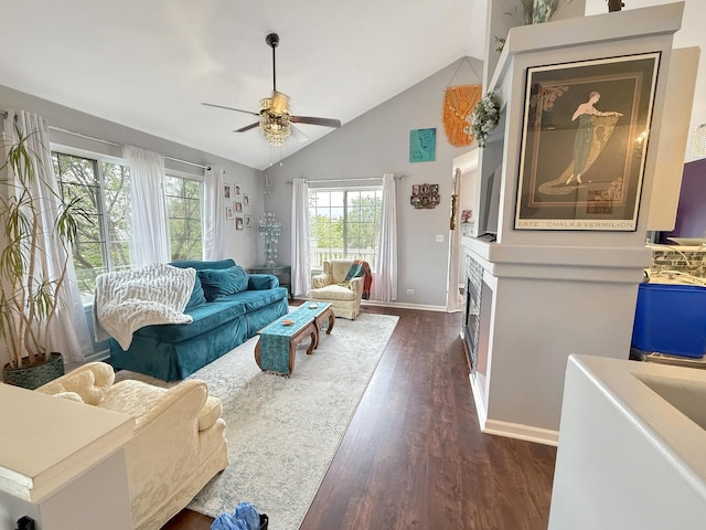 648 S Rosehall Ln, Round Lake, IL 60073 - living room with baseboards, ceiling fan, high vaulted ceiling, and dark wood-type flooring