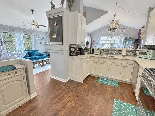 648 S Rosehall Ln, Round Lake, IL 60073 - kitchen featuring ceiling fan, a sink, stove, open floor plan, and white microwave