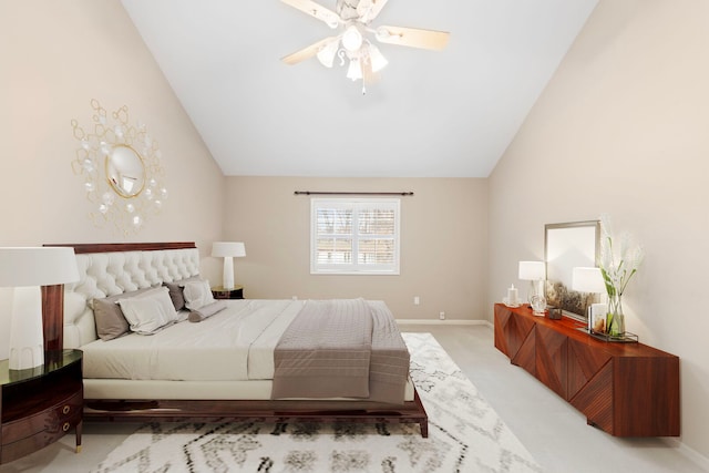 bedroom with light colored carpet, baseboards, and lofted ceiling