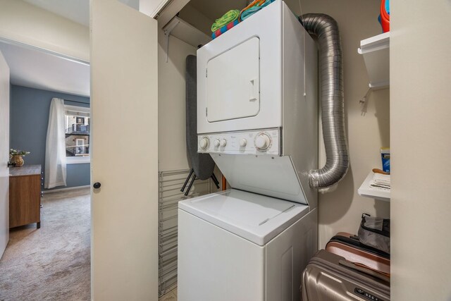 849 W Buckingham Pl Unit G, Chicago, IL 60657 - washroom with carpet floors, stacked washer and clothes dryer, and laundry area