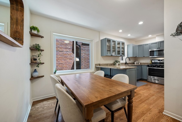 849 W Buckingham Pl Unit G, Chicago, IL 60657 - dining room featuring recessed lighting, baseboards, and light wood-type flooring