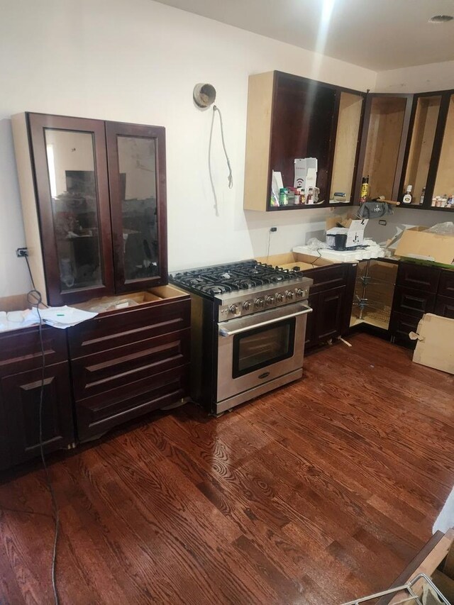 kitchen featuring high end stainless steel range and dark wood-style flooring