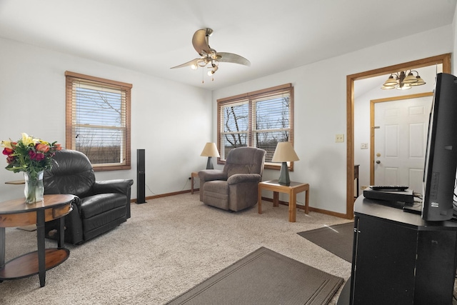 37115 N Sistina Ave, Lake Villa, IL 60046 - carpeted living room featuring baseboards, a healthy amount of sunlight, and ceiling fan with notable chandelier