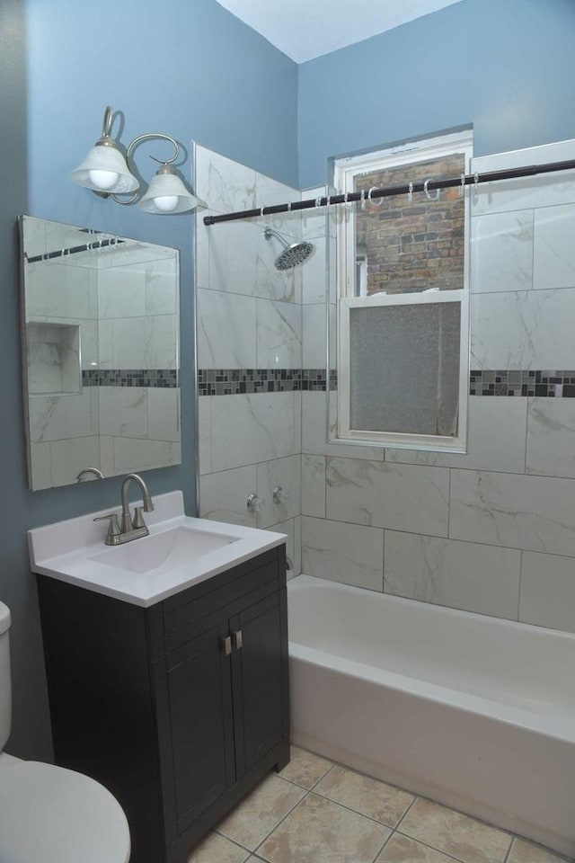 full bath featuring  shower combination, toilet, tile patterned flooring, and vanity