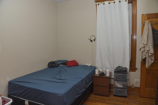 bedroom with wood finished floors