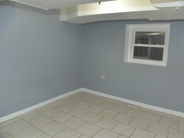 spare room featuring baseboards