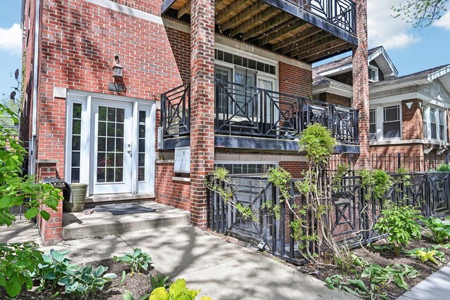 4310 N Richmond St Unit 1, Chicago, IL 60618 - entrance to property with brick siding and a balcony