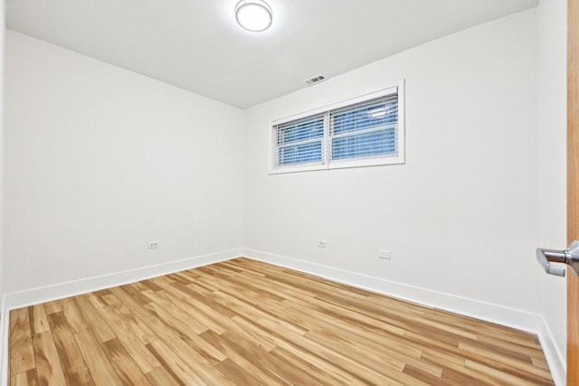 4310 N Richmond St Unit 1, Chicago, IL 60618 - spare room featuring baseboards and light wood-style flooring