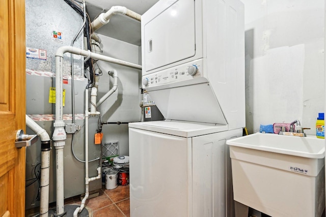 4310 N Richmond St Unit 1, Chicago, IL 60618 - laundry area with stacked washer / dryer and tile patterned floors