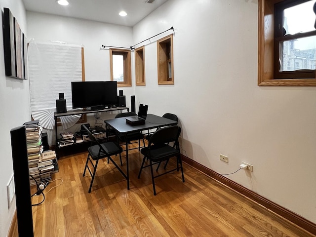 office with baseboards, visible vents, wood finished floors, and recessed lighting