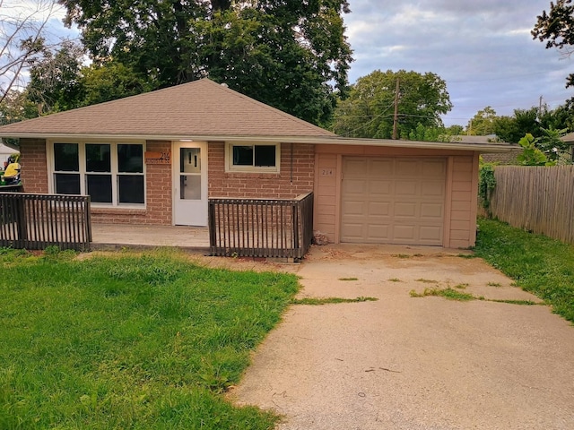 214 Augusta Dr, Mahomet, IL 61853 - ranch-style house featuring driveway, an attached garage, fence, and brick siding