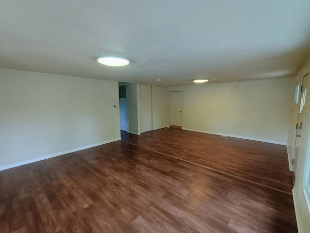 214 Augusta Dr, Mahomet, IL 61853 - unfurnished room featuring baseboards and dark wood-style flooring