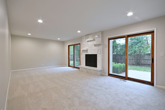 6S210 Mariwood Ct, Naperville, IL 60540 - unfurnished living room with carpet, healthy amount of natural light, baseboards, recessed lighting, and a fireplace