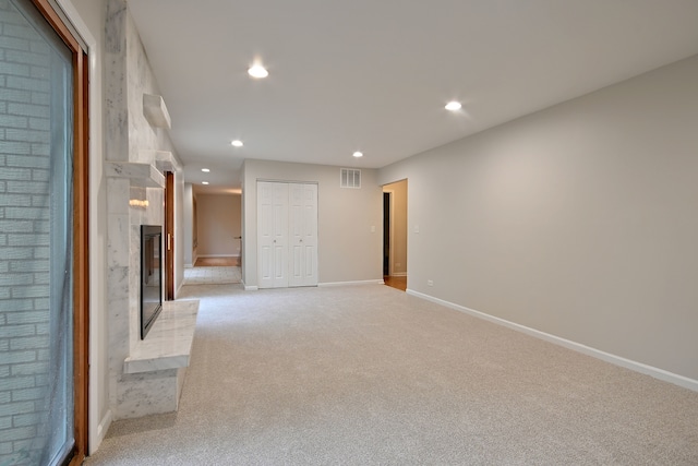 6S210 Mariwood Ct, Naperville, IL 60540 - unfurnished living room with light colored carpet, recessed lighting, baseboards, and a large fireplace