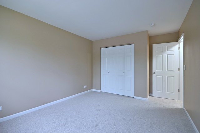 6S210 Mariwood Ct, Naperville, IL 60540 - unfurnished bedroom with light colored carpet, baseboards, and a closet