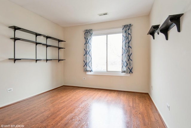 7010 Dover Ct Unit 203, Woodridge, IL 60517 - empty room featuring visible vents, baseboards, and wood finished floors
