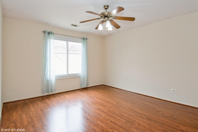 7010 Dover Ct Unit 203, Woodridge, IL 60517 - unfurnished room featuring wood finished floors, baseboards, a ceiling fan, and visible vents