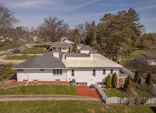 1213 S Homestead Ave, Freeport, IL 61032 - back of property with central air condition unit, fence, and a yard