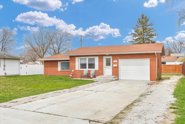 ranch-style home featuring driveway, an attached garage, fence, and brick siding