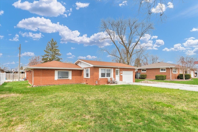 ranch-style house with fence, a garage, brick siding, a front lawn, and driveway