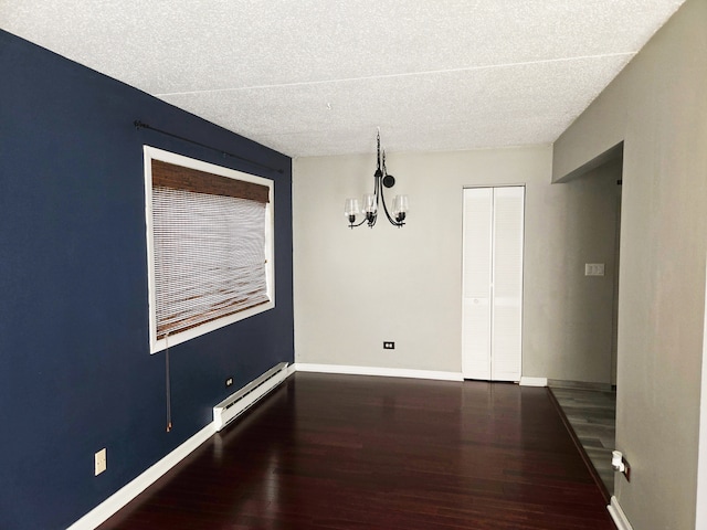 324 Klein Creek Ct Unit A, Carol Stream, IL 60188 - unfurnished dining area with a baseboard radiator, wood finished floors, a chandelier, baseboards, and a textured ceiling
